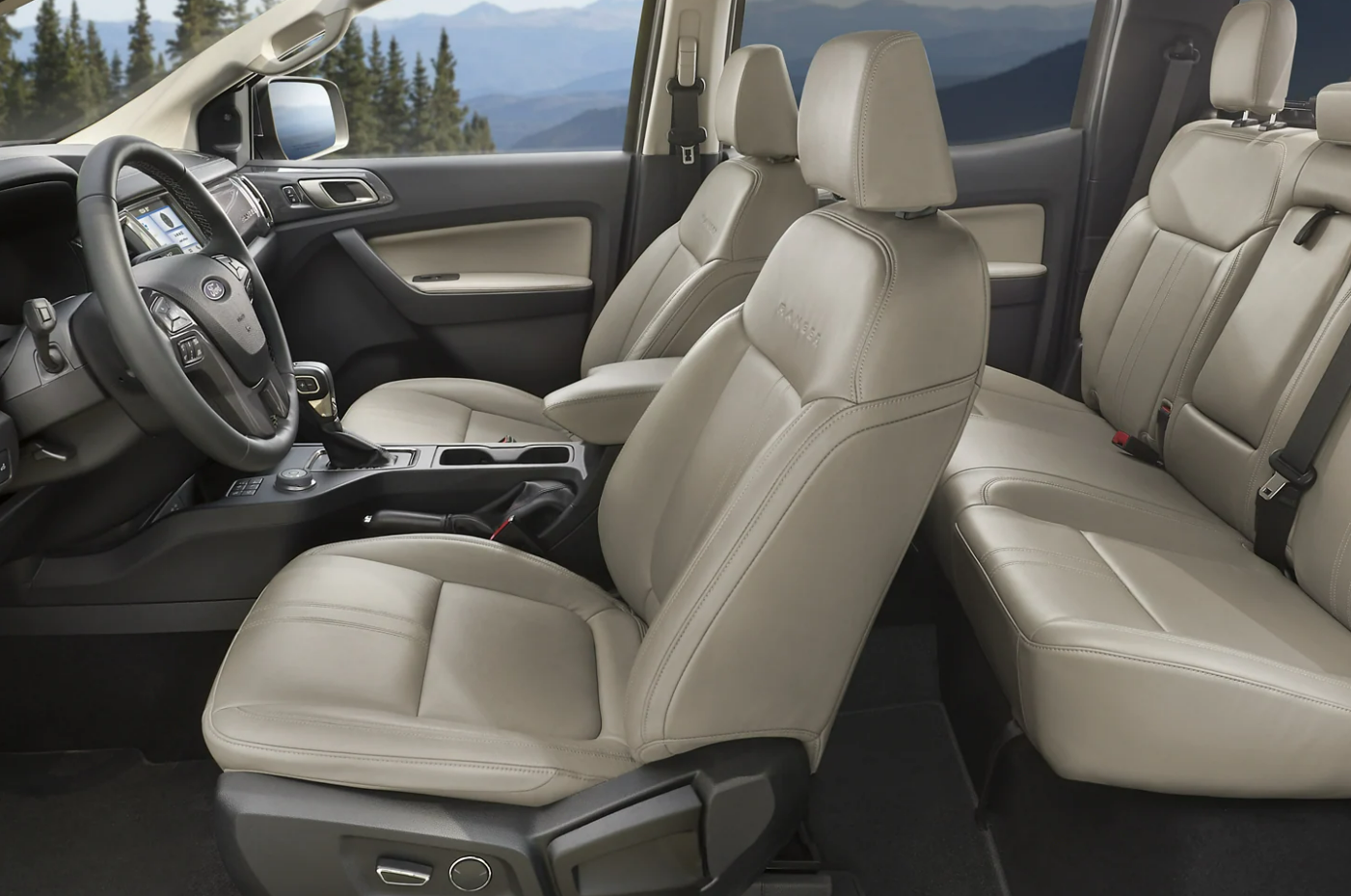 A view of the seating of a 2023 Ford Ranger upholstered in light gray leather