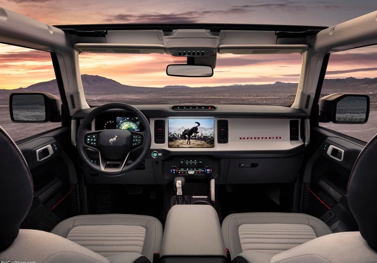 The dashboard of a 2023 Ford Bronco Raptor SUV with a view of the mountains out the window