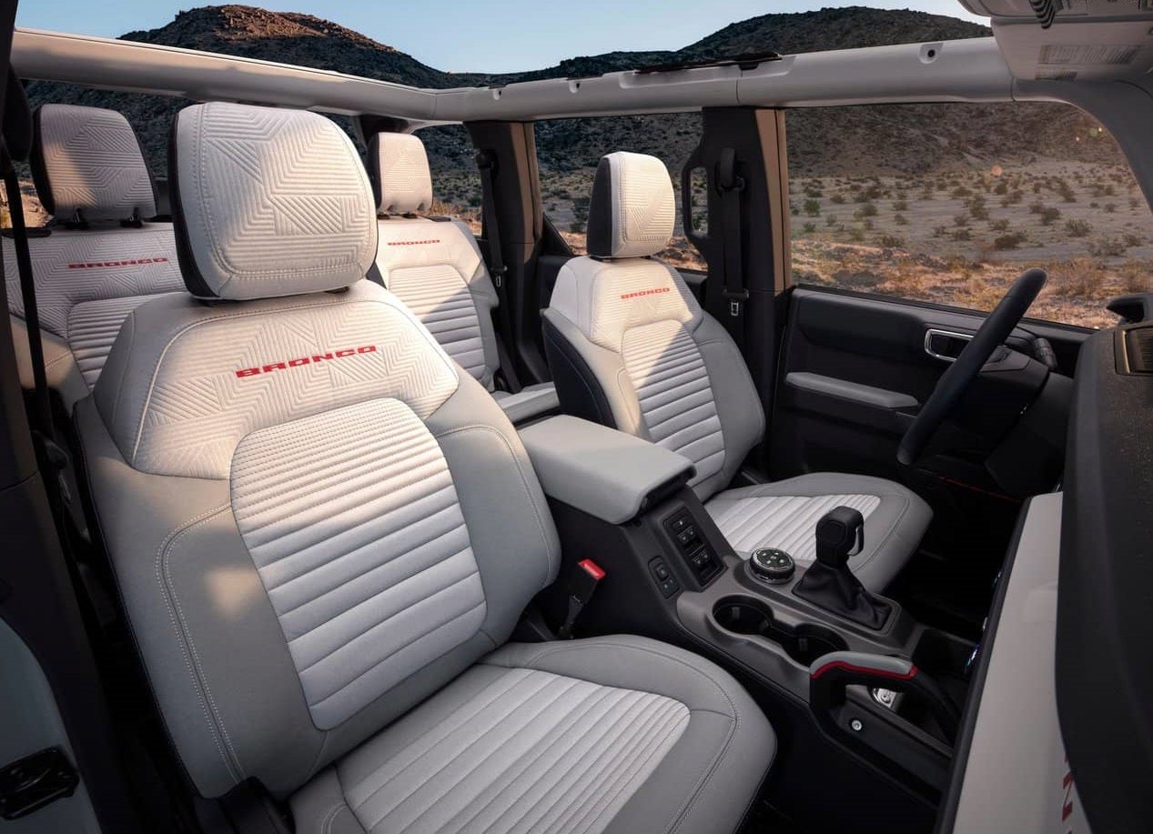 Seating of a 2023 Ford Bronco Raptor driving through the wilderness