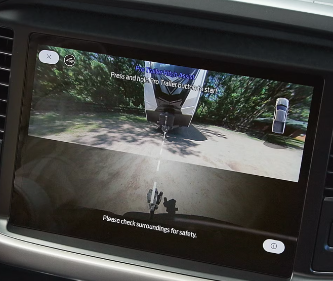 Interior of Chevy Silverado showing its infotainment screen and dashboard.