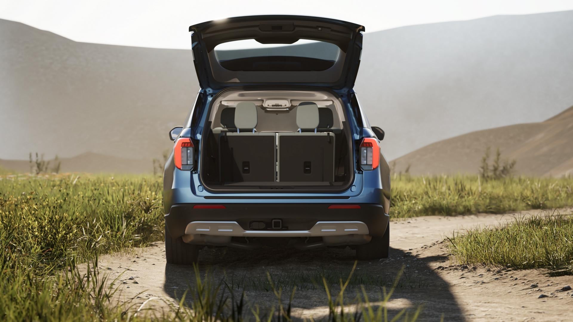Rear view of the 2026 Ford Explorer with the back hatch open showing extensive cargo space