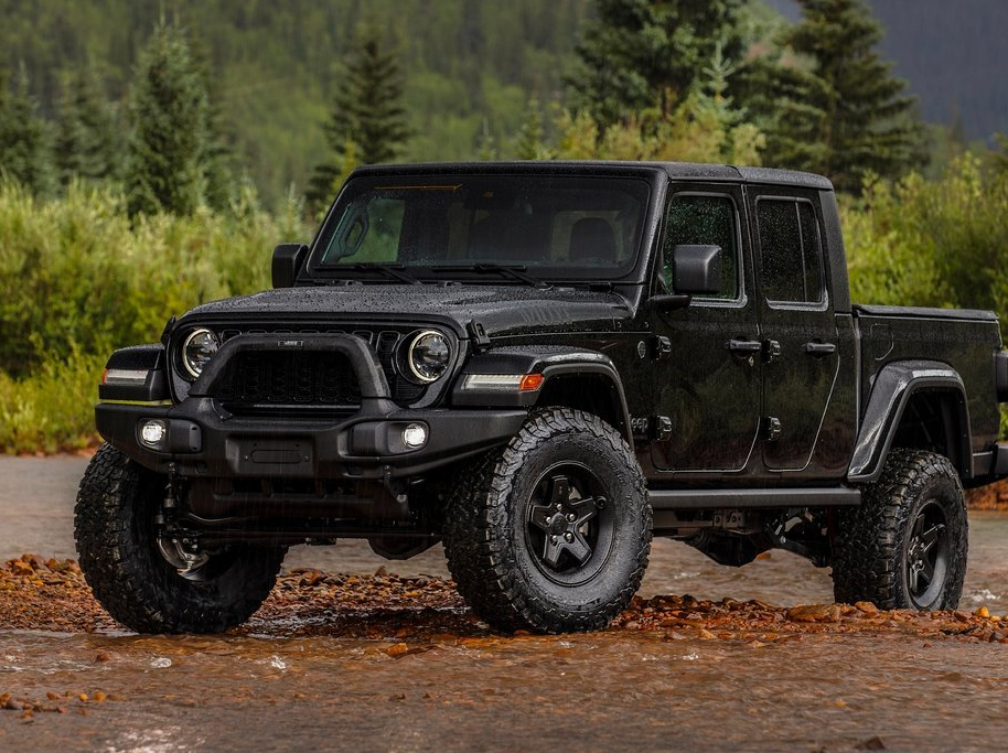 A black 2025 Jeep Gladiator on an off-road trail